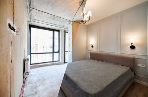 Apartment bedroom before and after renovation.